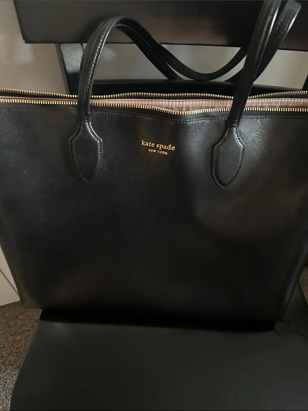 kate spade black leather tote with gold logo and zipper